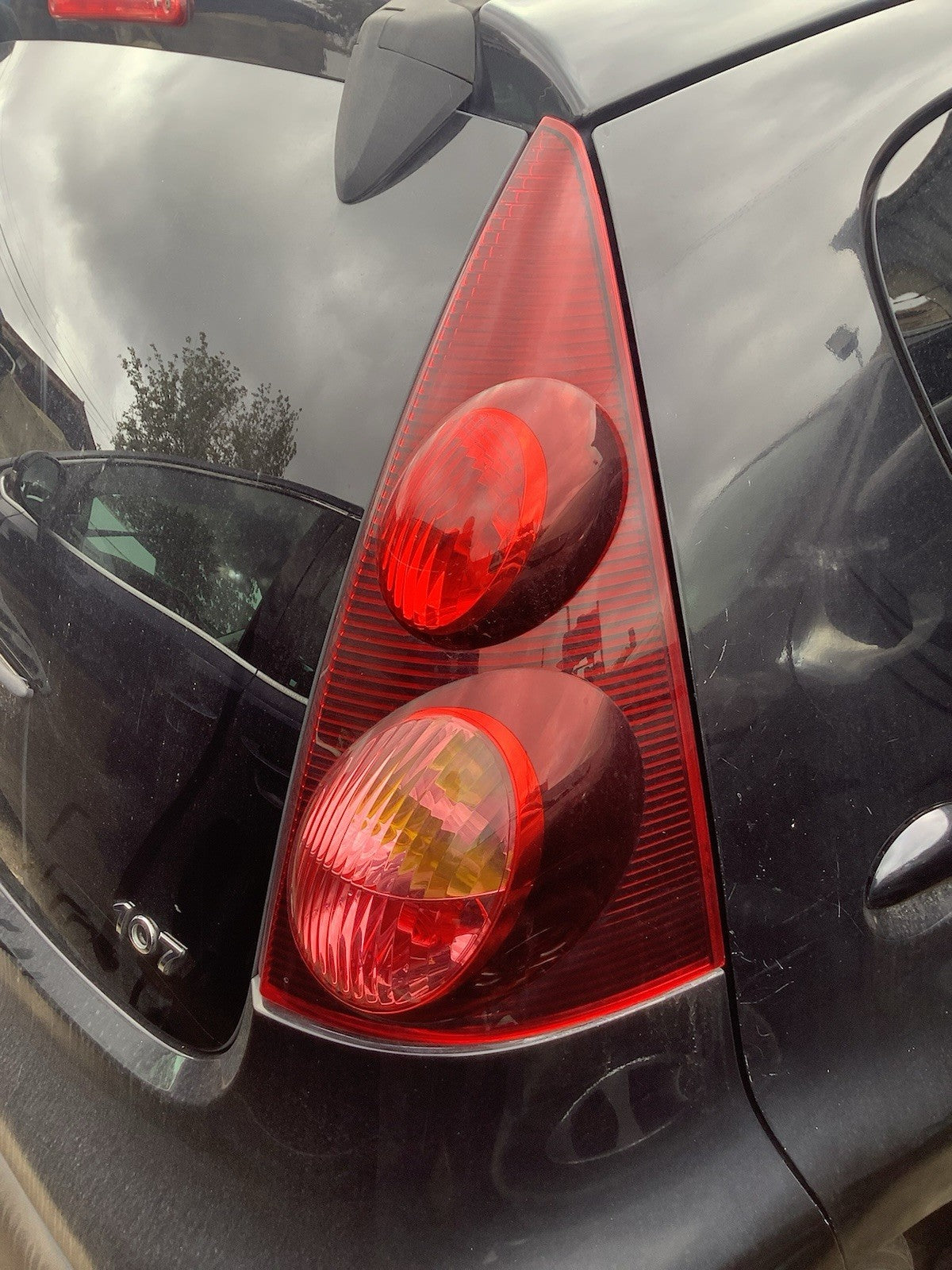 PEUGEOT 107 DRIVER'S SIDE O/S REAR LIGHT DARK TINT 2012 20141