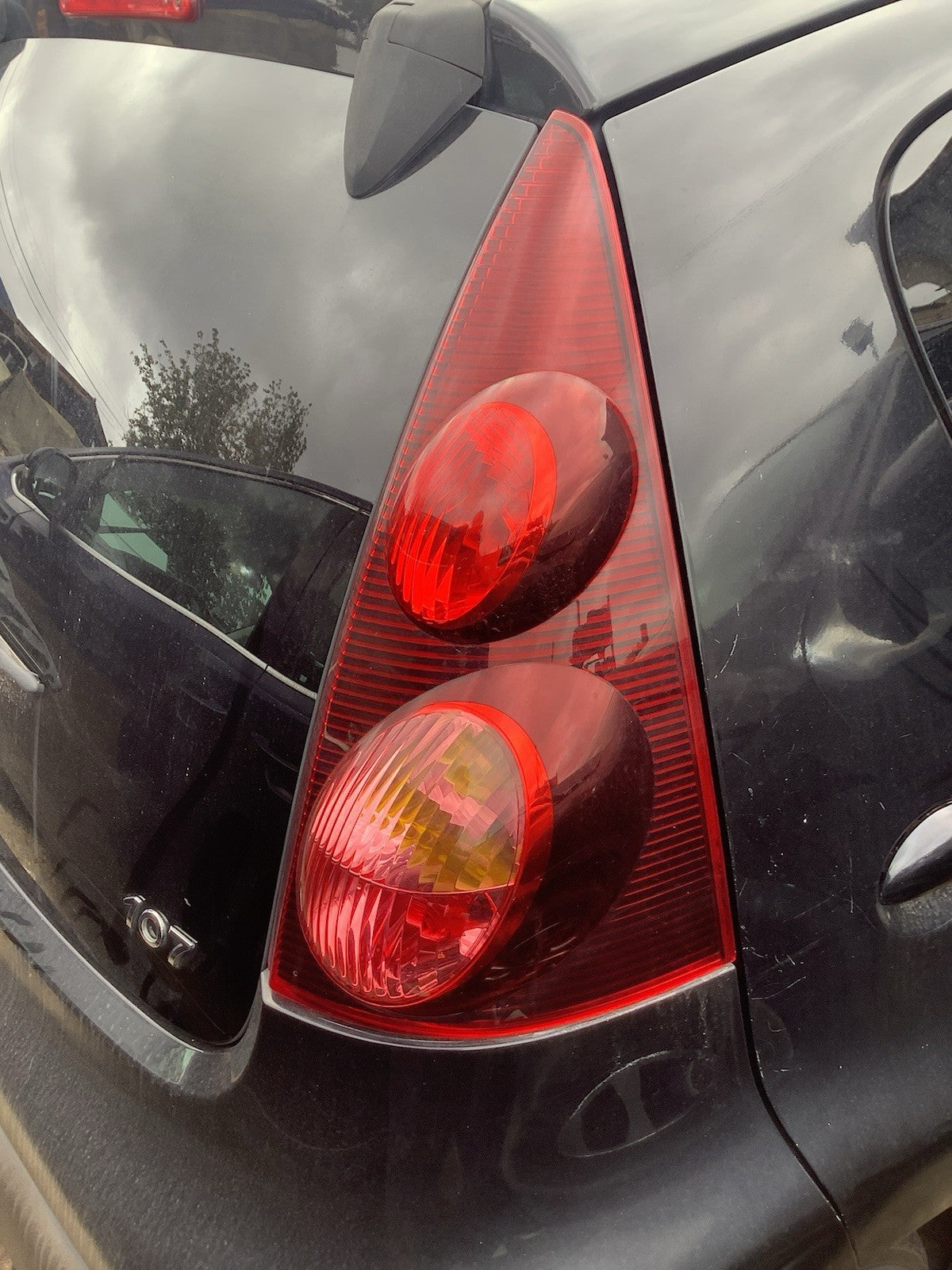 PEUGEOT 107 DRIVER'S SIDE O/S REAR LIGHT DARK TINT 2012 20140