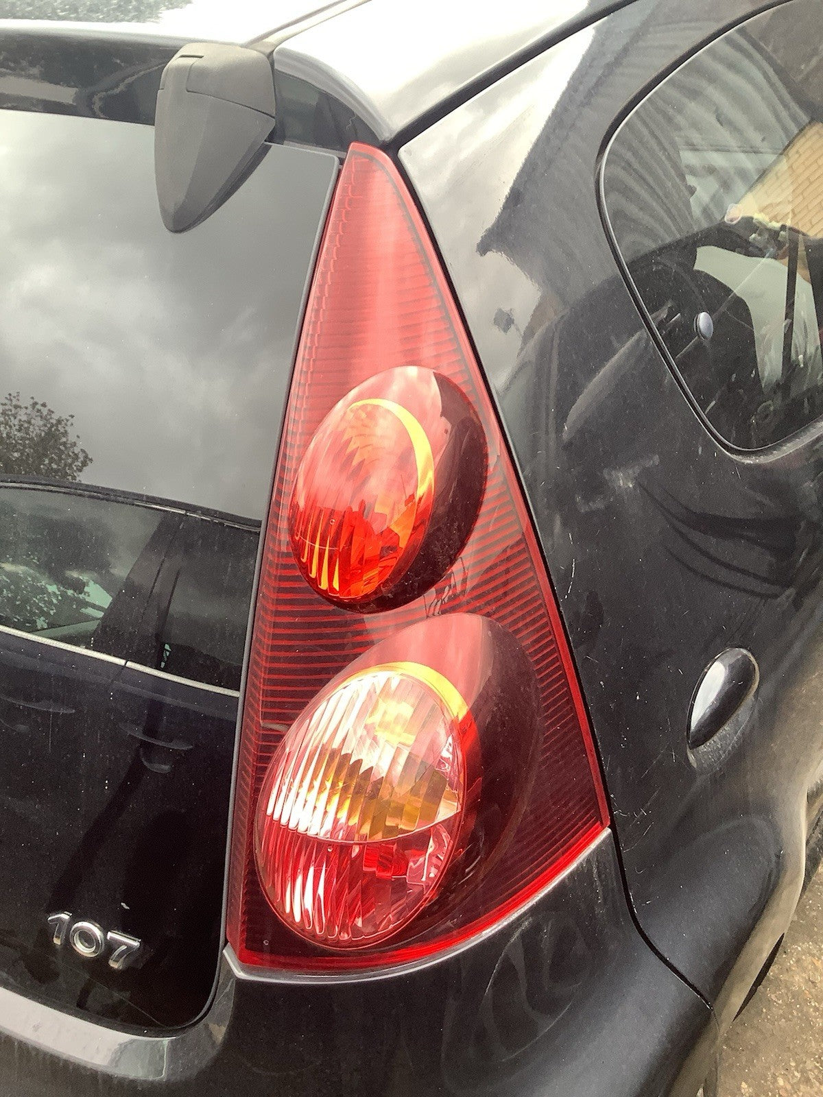 PEUGEOT 107 DRIVER'S SIDE O/S REAR LIGHT DARK TINT 2012 20143